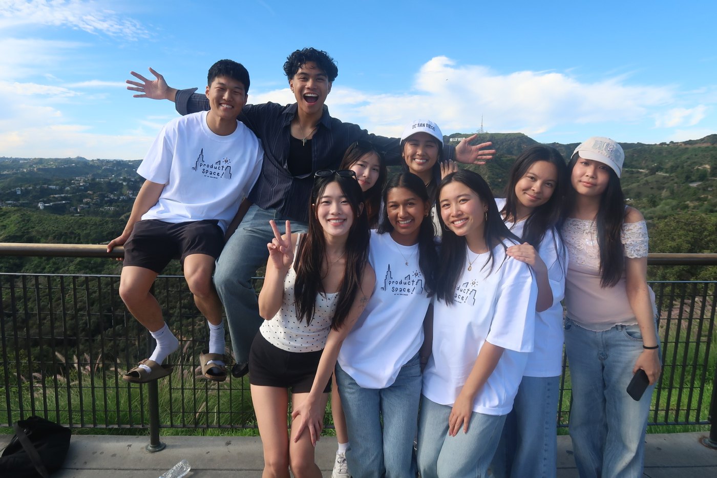 Friends at an overlook with the Hollywood Sign in the distance
