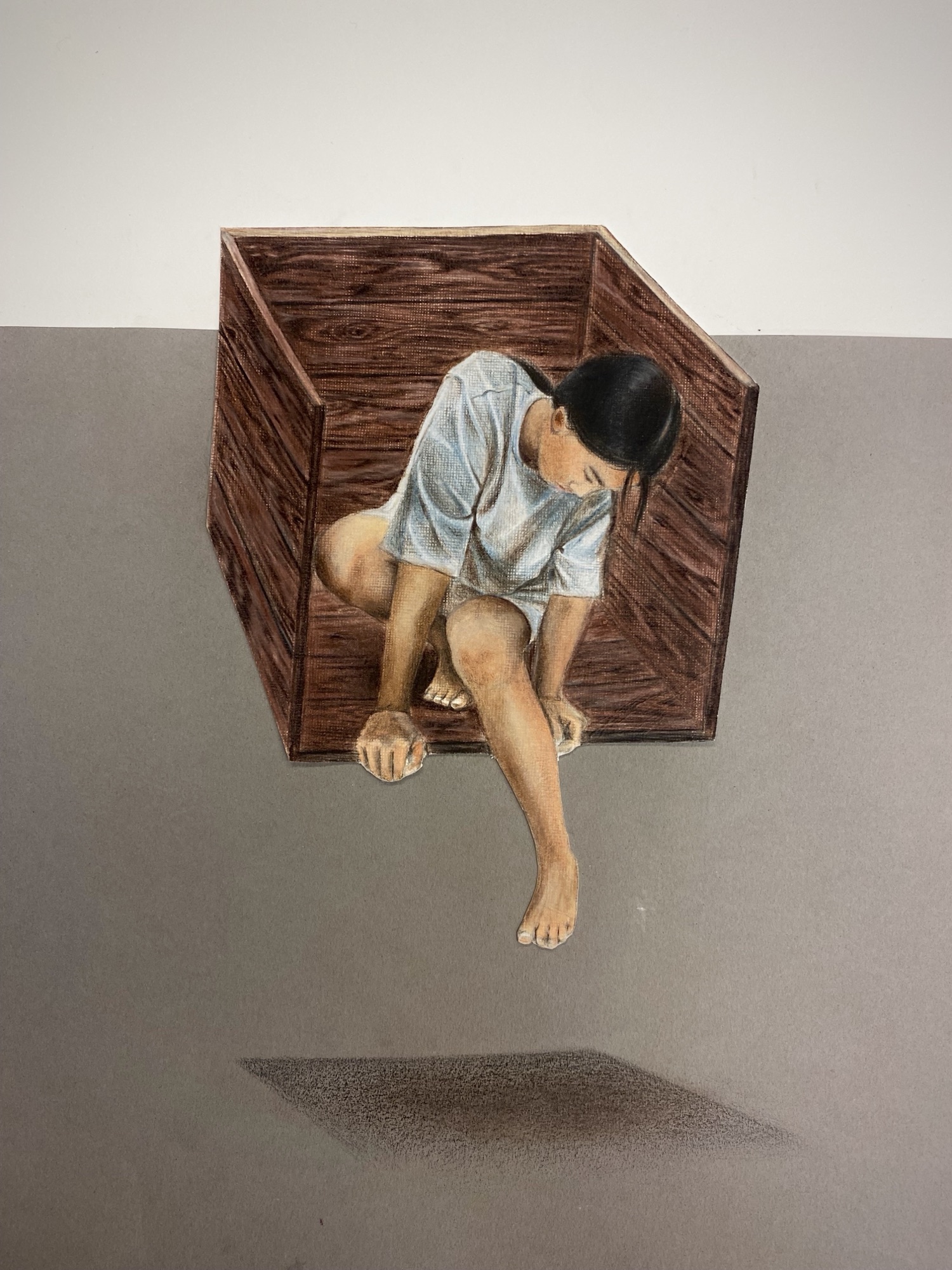 comfort zone, a figure crouched inside a wooden box
